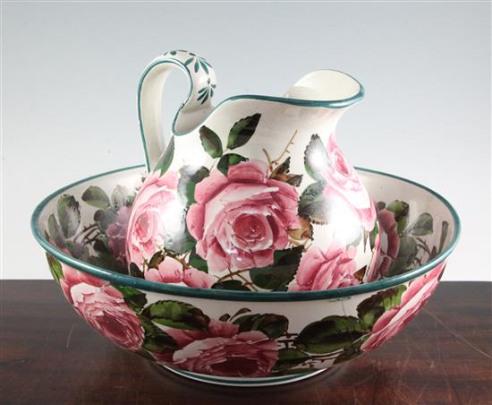 A Wemyss cabbage rose pattern wash basin and ewer, early 20th century, basin diameter 39.5cm, basin restored